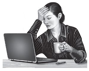 Woman with headache at computer