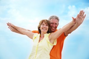 Couple with arms outstretched