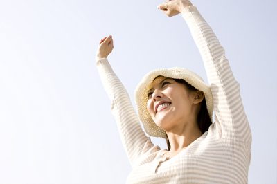 Bioidentical-Hormones-woman-arms-raised-600×399